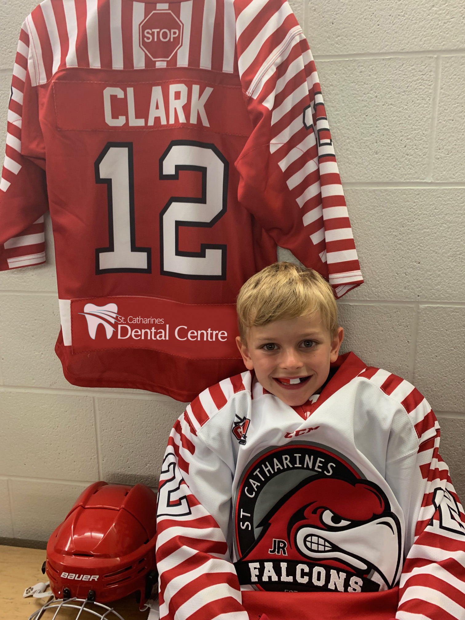 Oral Appliances Young Boy wearing a dental guard with a hockey jersey in the background